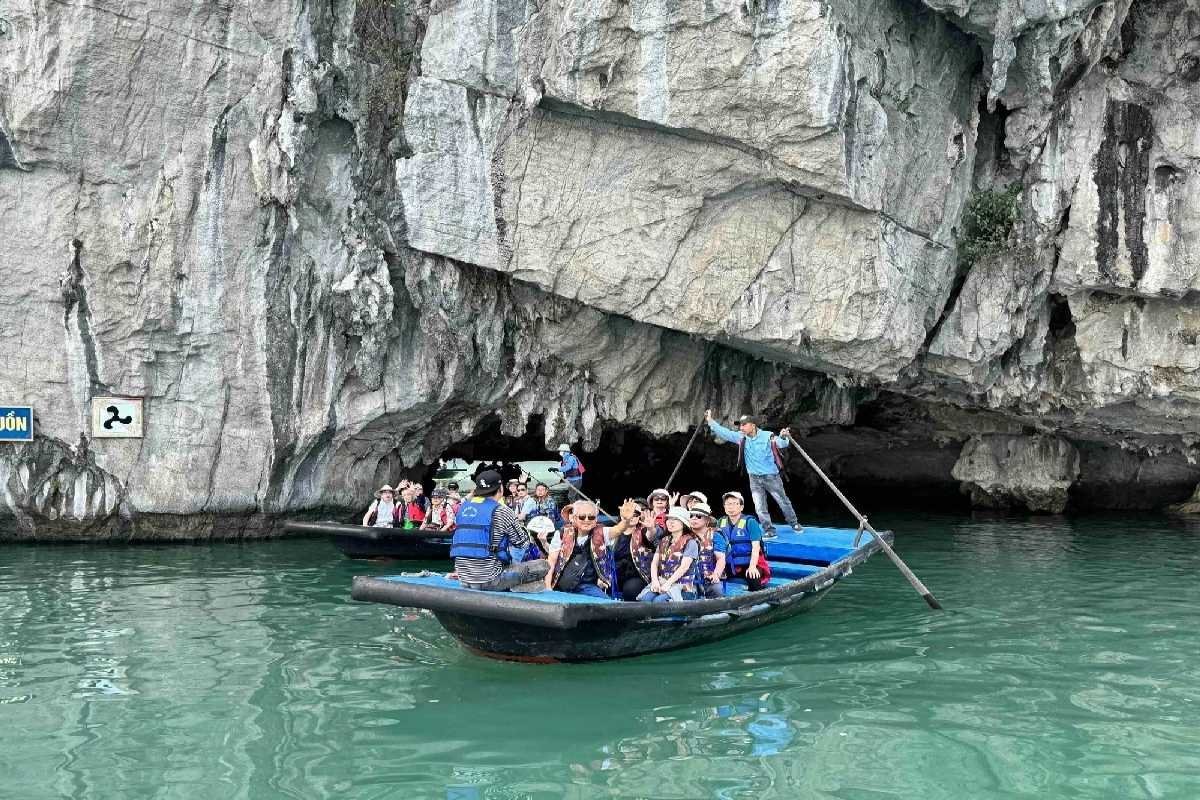 Inside Luon Cave with traditional sampan