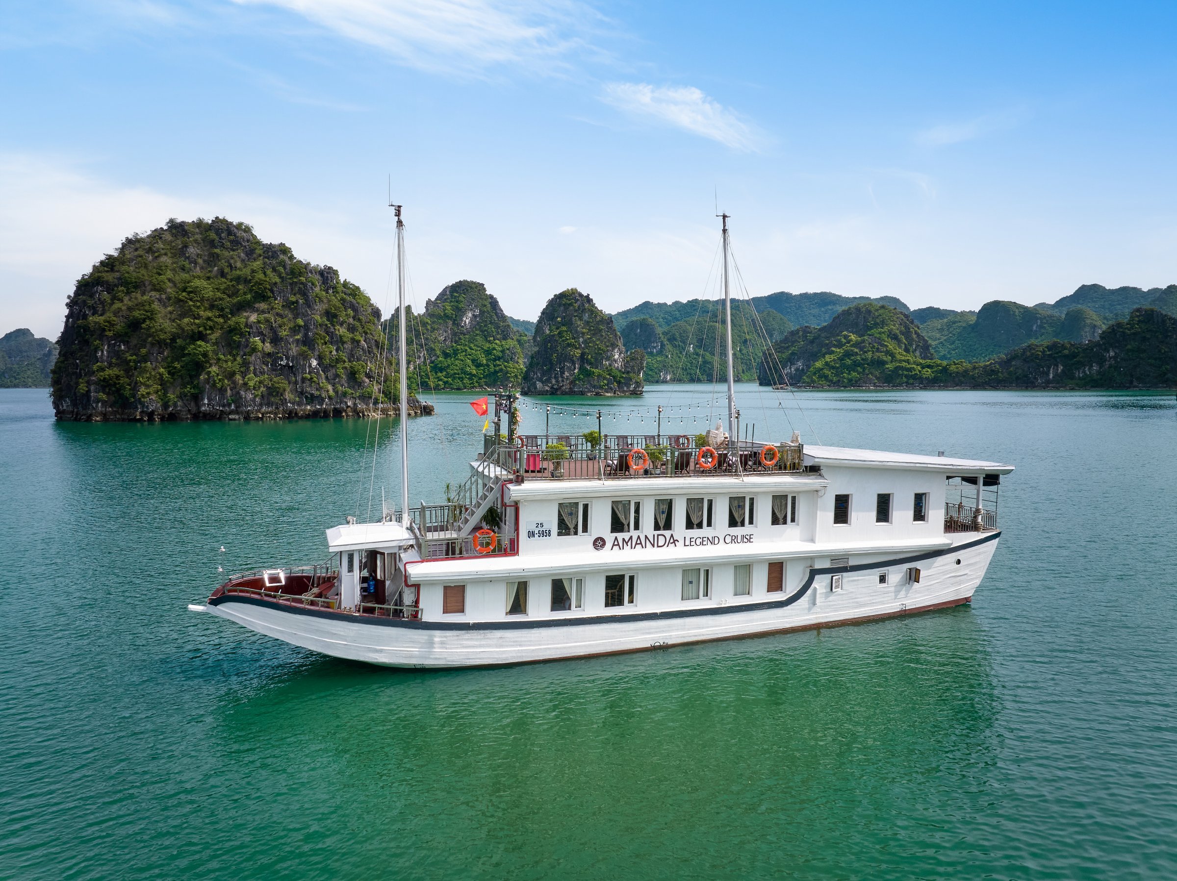 Aerial view of Halong Bay limestone karsts at golden hour